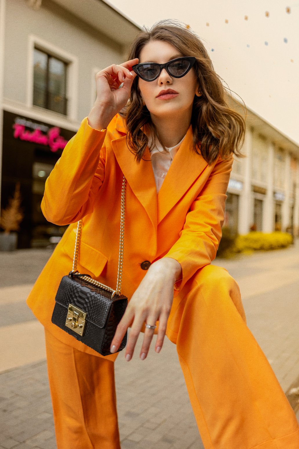 Woman Posing in Orange Clothes